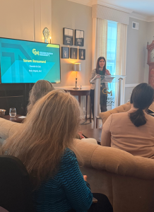 Main Digital CEO Sanam Boroumand speaks at a podium, with an audience listening.